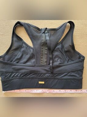 Alala Black Racerback Sports Bra with Back Zip Detail. Medium